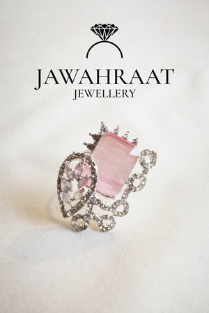 Front view of the Elara ring in blush pink by Jawahraat Jewellery – romantic silver-tone adjustable ring with central rectangular stone and pave accents.