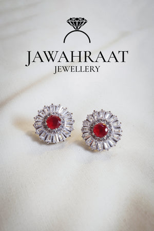 Silver teardrop earrings with red stones and crystal detailing, ideal for formal and festive wear