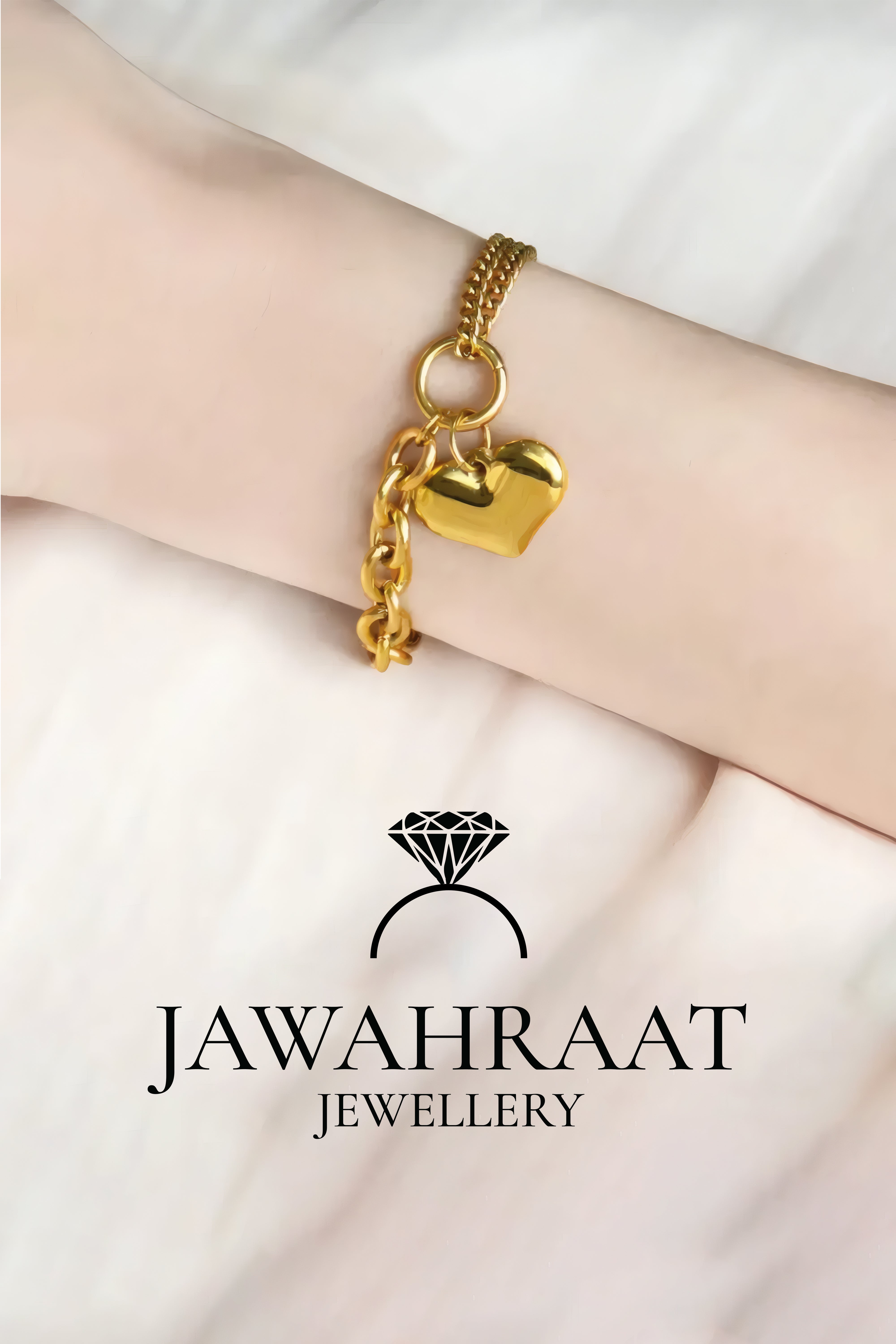 Close-up of adjustable gold heart charm bracelet with double chain design, artificial jewelry by Jawahraat Jewellery