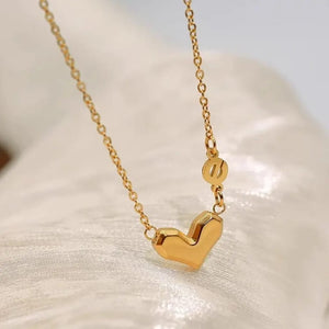 Minimal gold heart necklace with polished finish