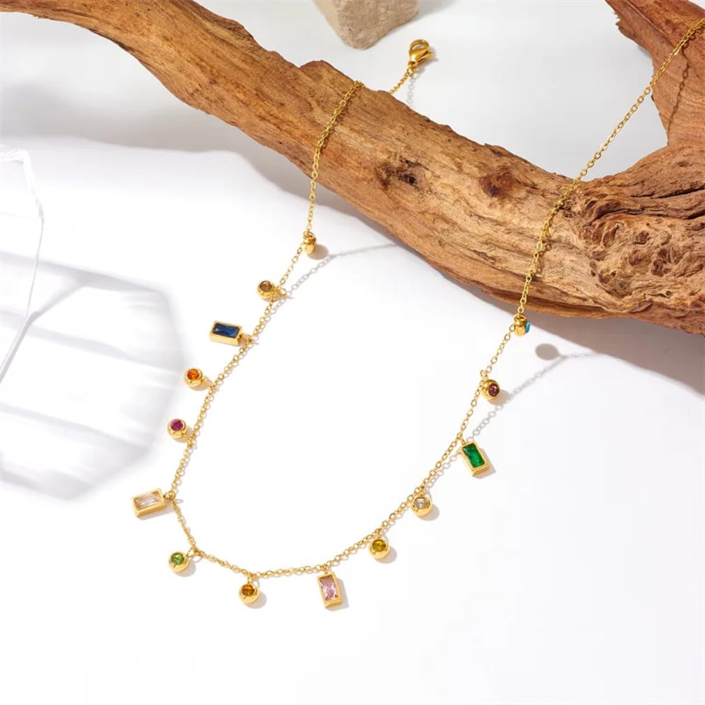 Gold plated necklace with colorful crystal charms close up