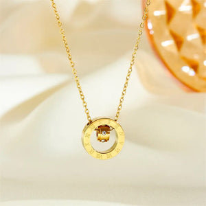 Close up of Roman numeral pendant with crystal inner ring detail