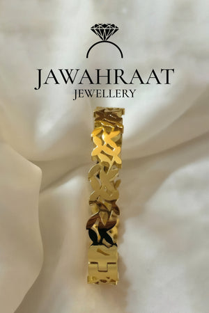 Gold-tone artificial interlocking leaf link bracelet on white background