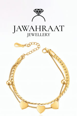 Gold plated heart bracelet on wrist with heart charms – Jawahraat Jewellery