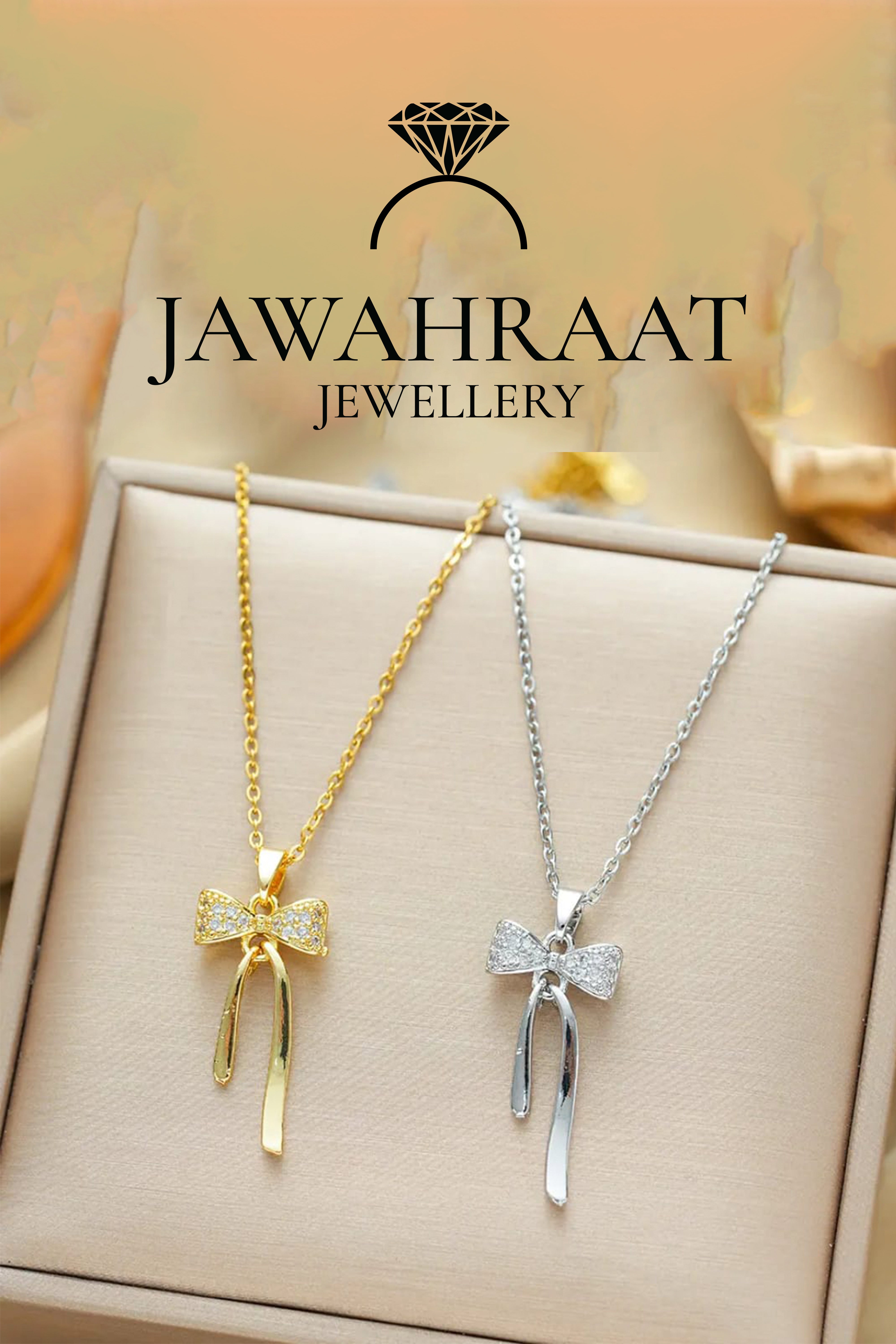 Gold and silver bow pendant necklaces by Jawahraat Jewellery shown side by side, both featuring delicate chains and sparkling cubic zirconia accents — perfect for versatile styling or gifting.

