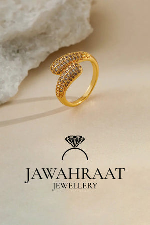 Opposite side view of gold-toned crystal twist ring by Jawahraat Jewellery, showing the elegant curve and encrusted crystal detailing from another angle.

