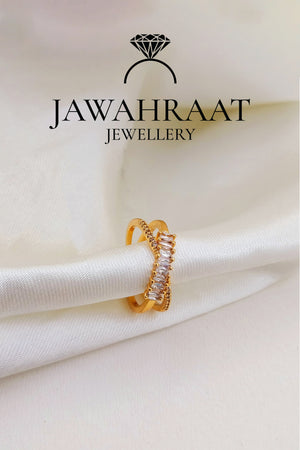 Gold-toned cross ring by Jawahraat Jewellery, featuring a bold criss-cross design adorned with sparkling crystals for a glamorous and refined look.

