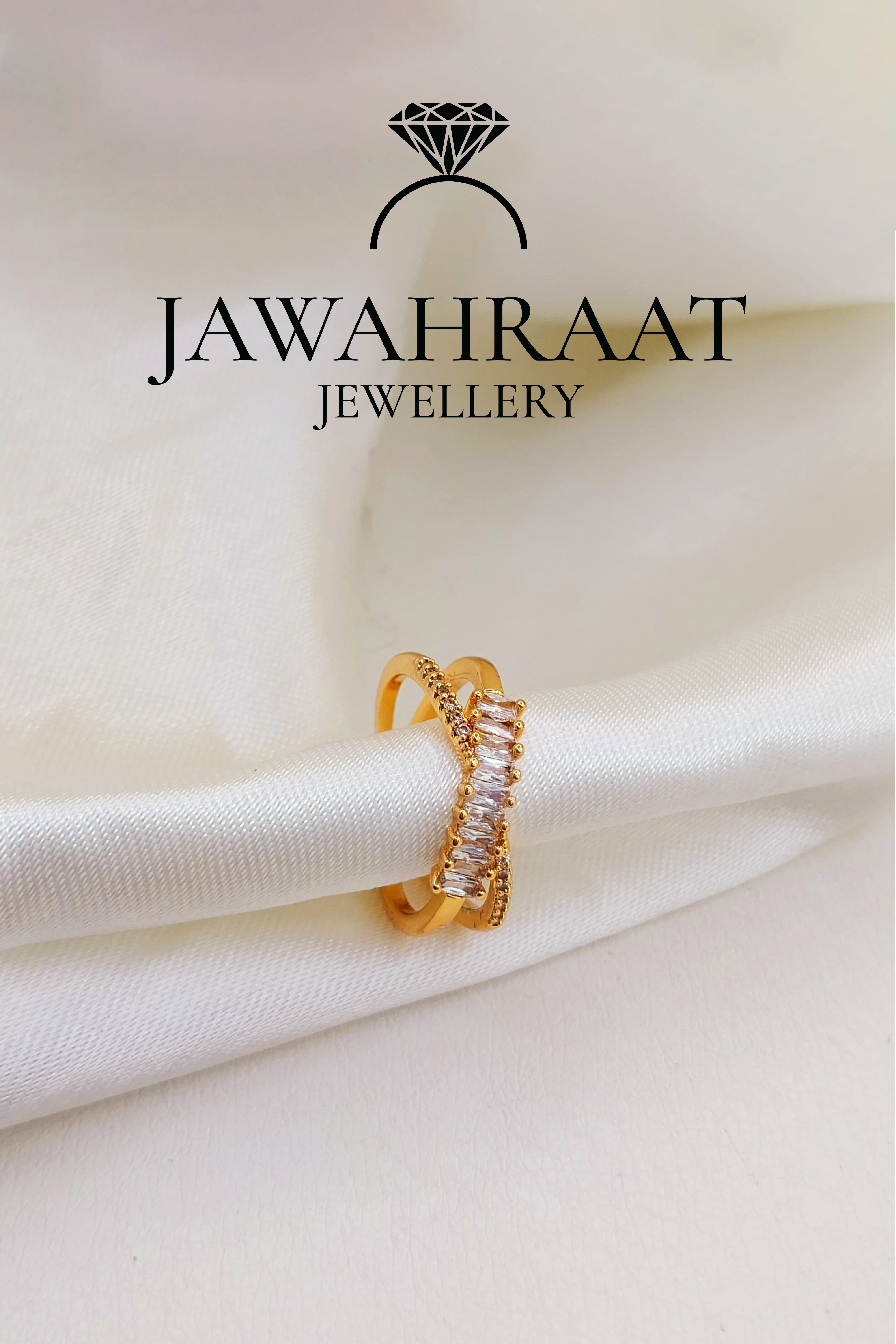 Gold-toned cross ring by Jawahraat Jewellery, featuring a bold criss-cross design adorned with sparkling crystals for a glamorous and refined look.


