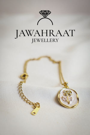 Elegant gold-tone stainless steel necklace featuring a delicate rose pendant, perfect for everyday elegance with anti-tarnish shine.

