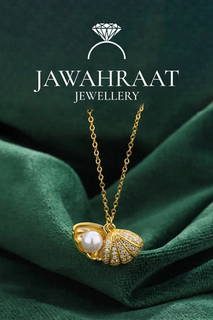 Clear front view of the Golden Seashell Pearl Pendant Necklace featuring an elegant open shell with faux pearl and second textured shell charm.

