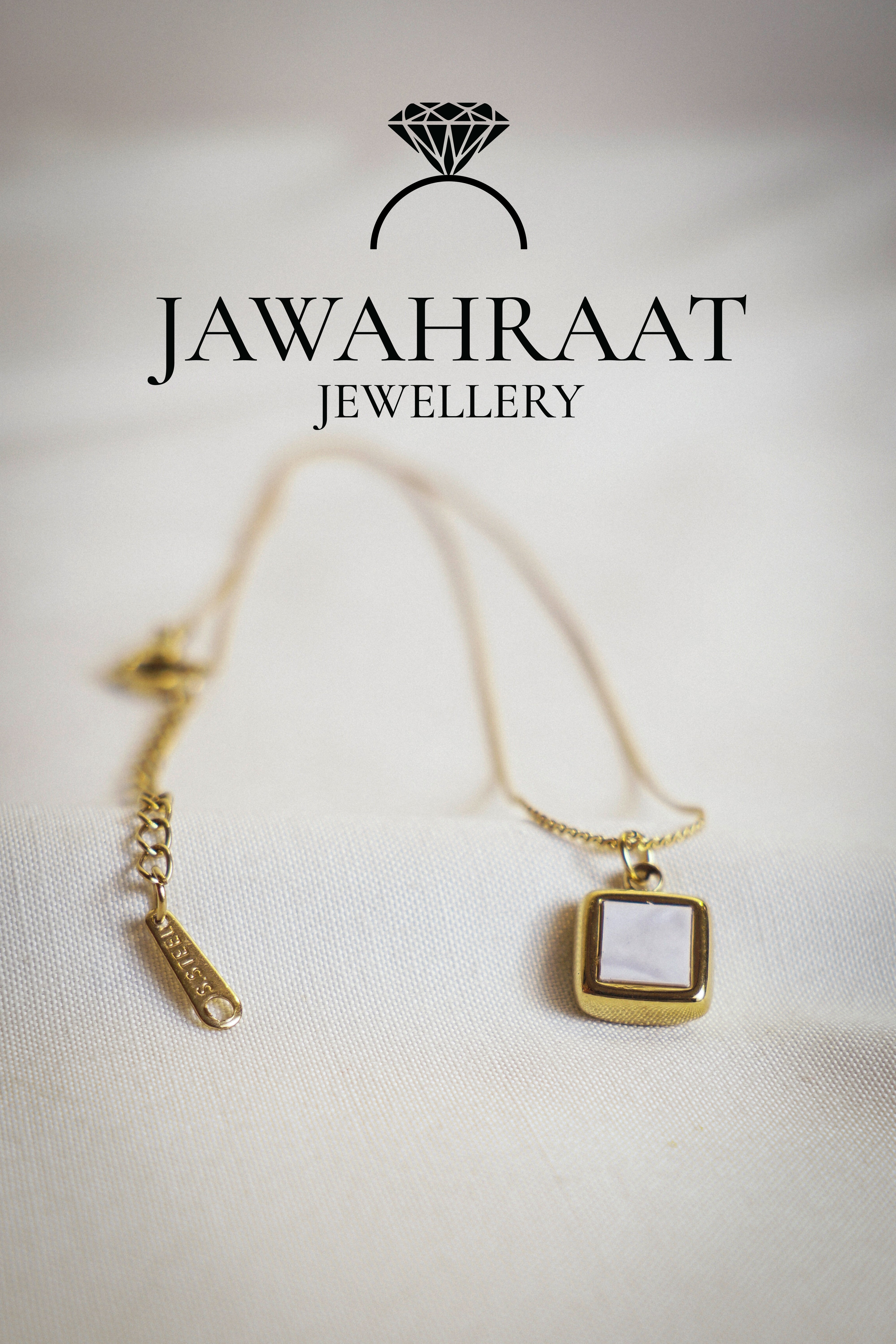 Minimal gold-toned necklace by Jawahraat Jewellery, featuring a dainty square pendant with a soft white stone — perfect for everyday wear and elegant layering.

