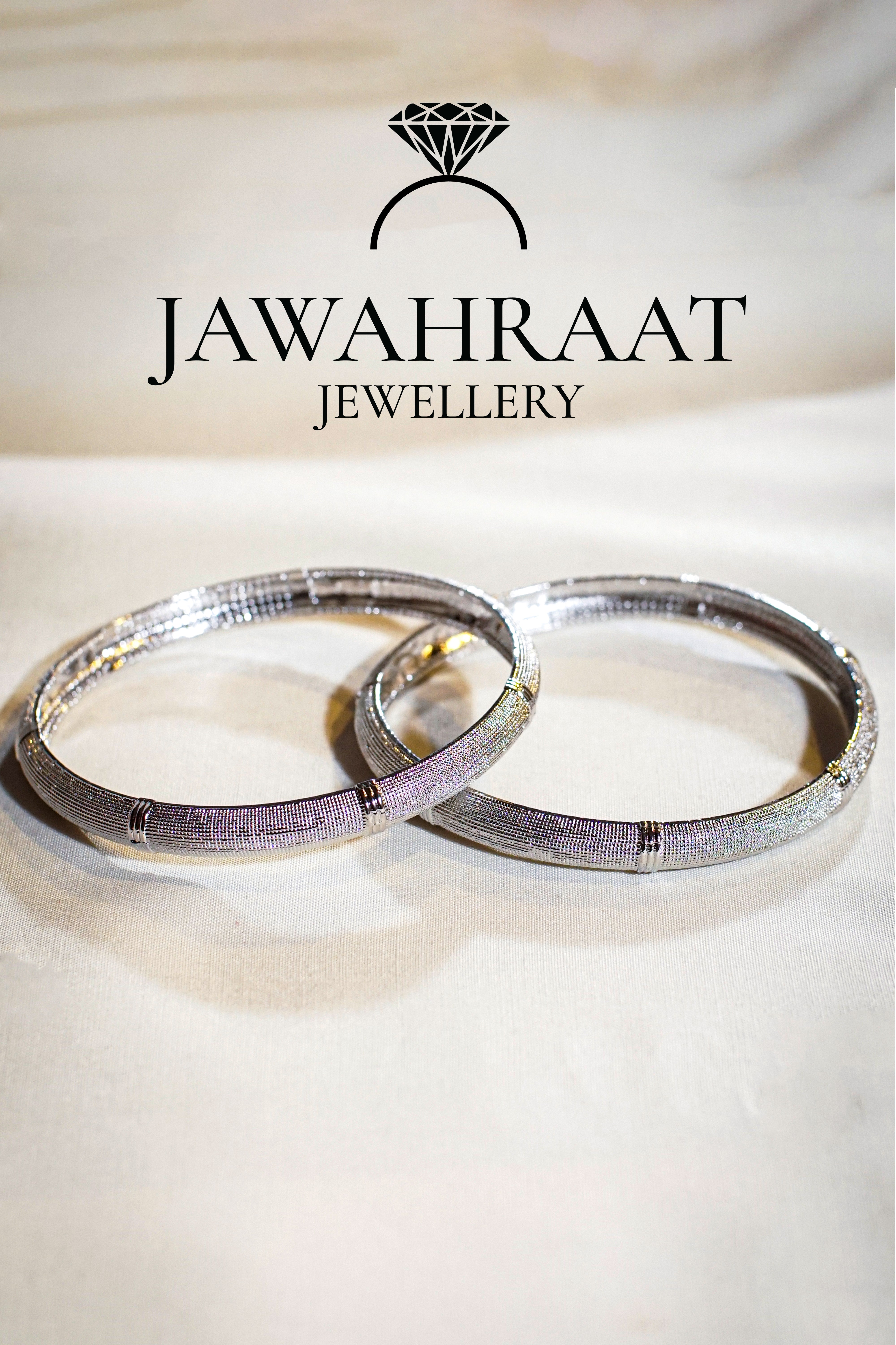 Classic silver-tone textured bangles by Jawahraat Jewellery, featuring polished accents — perfect for stacking or wearing solo for timeless elegance.

