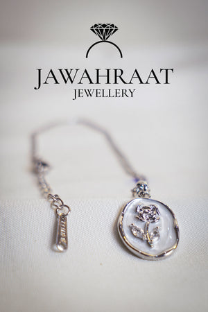 Stylish silver-tone stainless steel necklace with a rose-shaped pendant, combining minimalist charm with a long-lasting polished finish.

