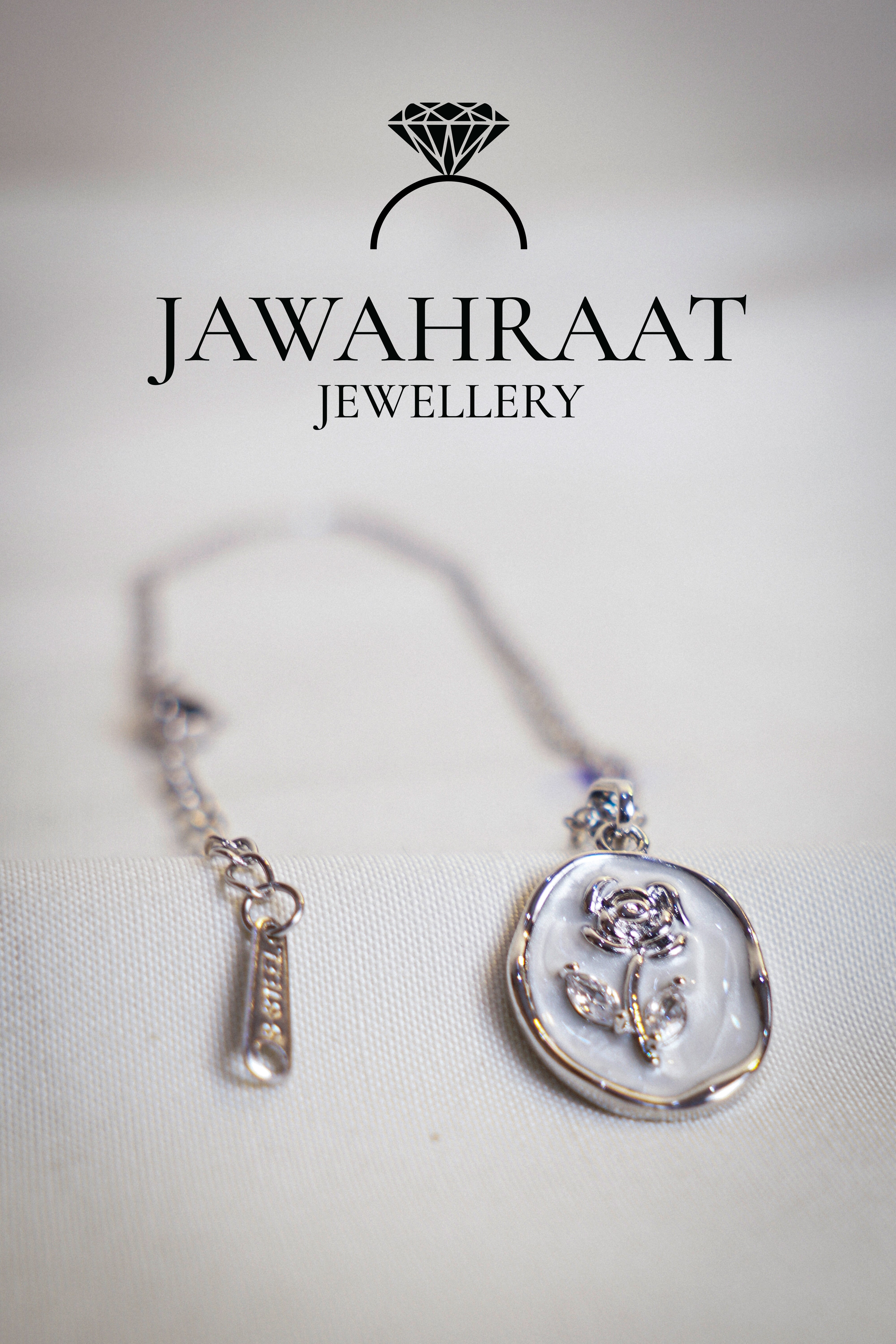 Stylish silver-tone stainless steel necklace with a rose-shaped pendant, combining minimalist charm with a long-lasting polished finish.

