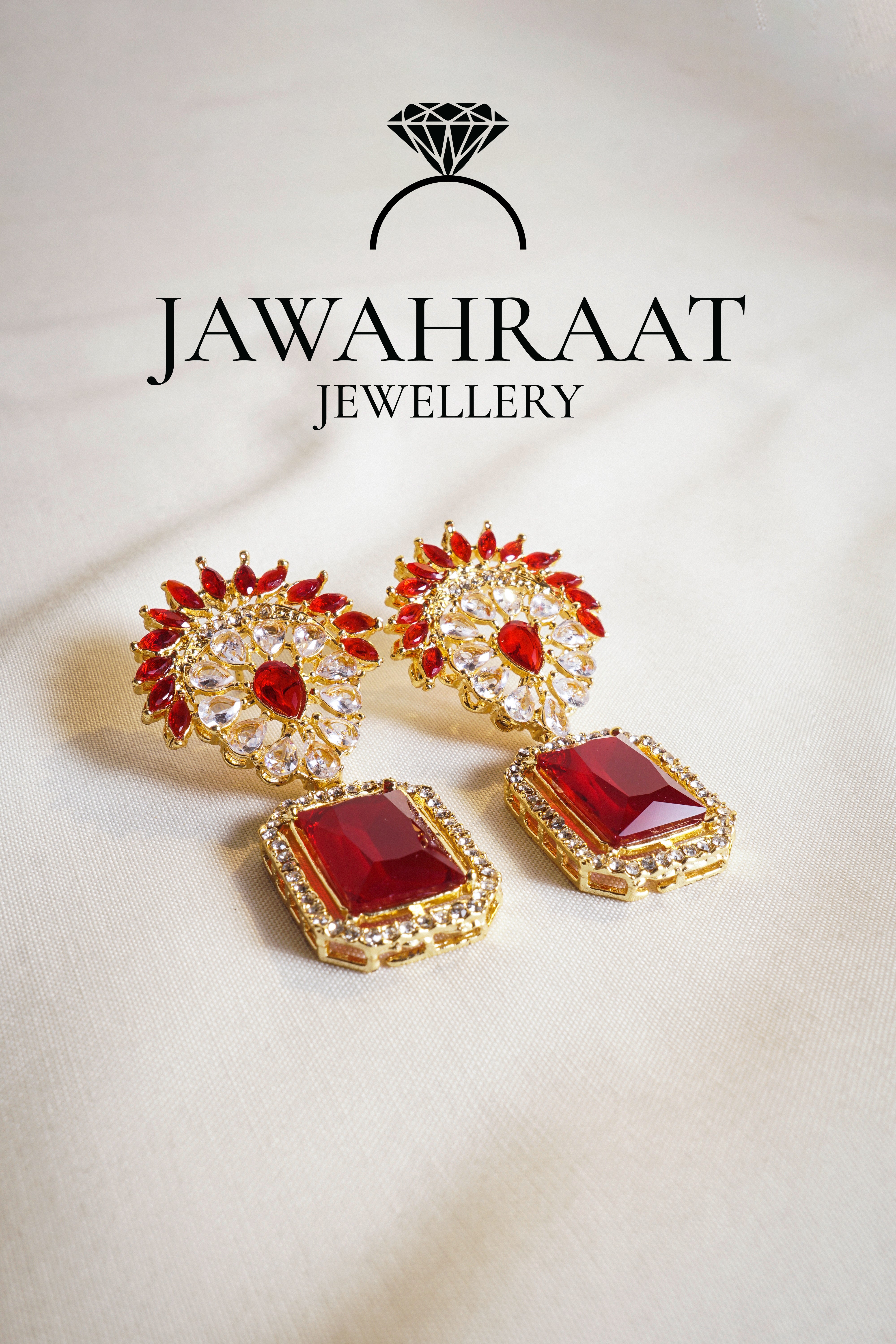 Front view of Zareen Earrings with deep red rectangular and round stones in gold-plated finish

