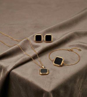 Black geometric gold plated artificial jewelry set with necklace bracelet and earrings