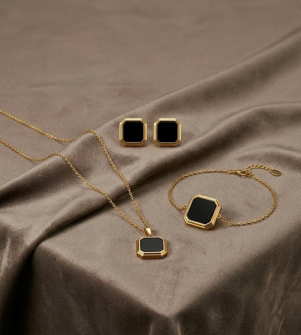 Black geometric gold plated artificial jewelry set with necklace bracelet and earrings
