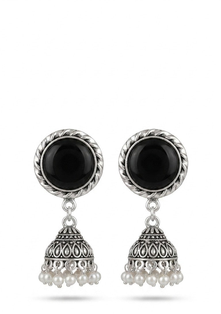Close-up of oxidized silver jhumka earrings with black stone centerpiece and pearl detailing