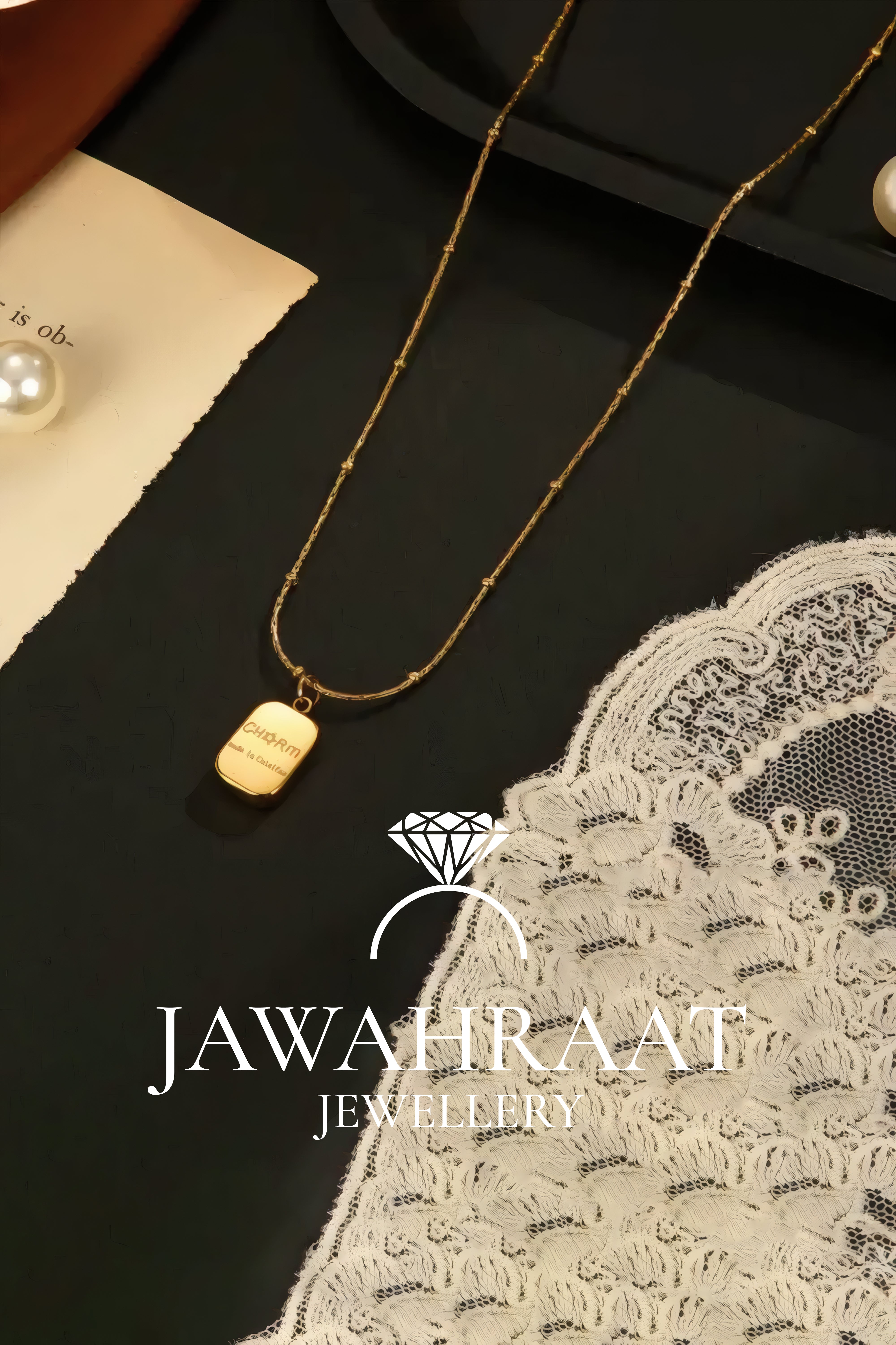 Minimalist gold plated bar pendant necklace displayed on satin fabric from Jawahraat Jewellery artificial jewelry brand